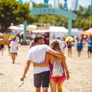 A couple walking at the Isle of Wight Festival