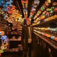 One young woman standing in a lighting shop