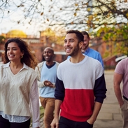Group of friends walking by the canal in Castlefield