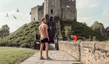 Man looking out at the castle view